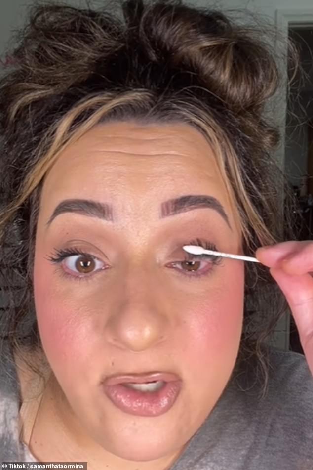 She then took the edge of the Q-Tip and pressed it repeatedly against her lashes, explaining that it was a good alternative to a metal lash curler