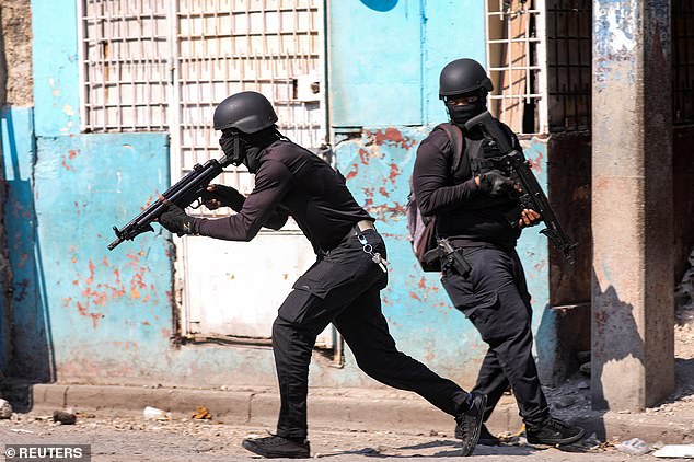Police officers take part in an operation in the surroundings of the national prison after a fire, as a powerful gang leader in Haiti has issued a threatening message aimed at political leaders who would participate in a still-unformed transitional council for the country
