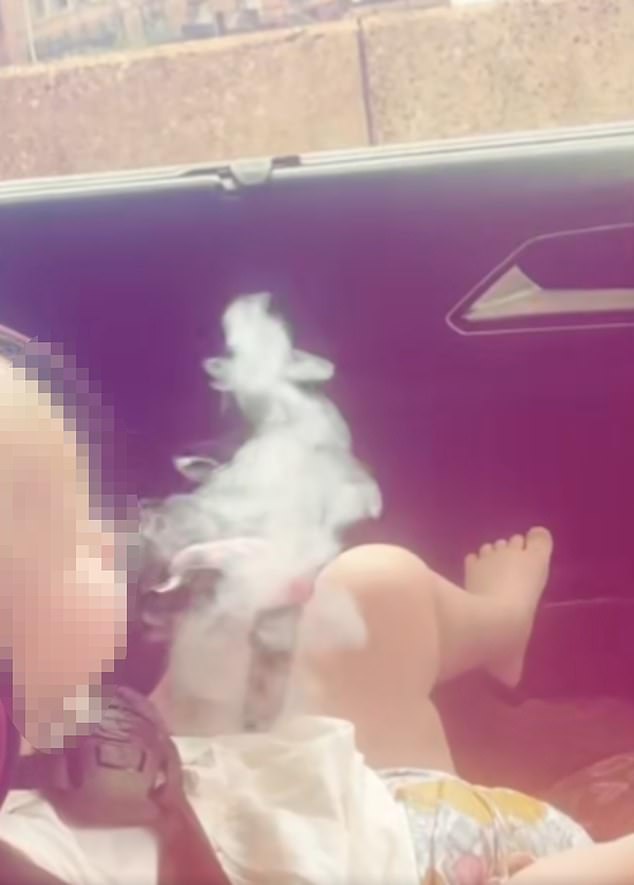 The smoke that the toddler blew out was so strong that it caused another older child in the car to cough