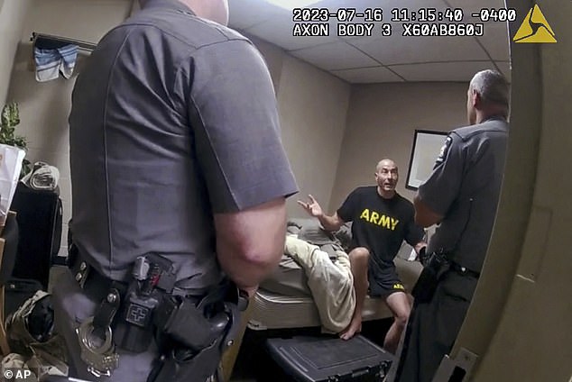 The footage offers a harrowing glimpse of Card after he was involved in an argument and locked himself in his motel room, alerting reservists