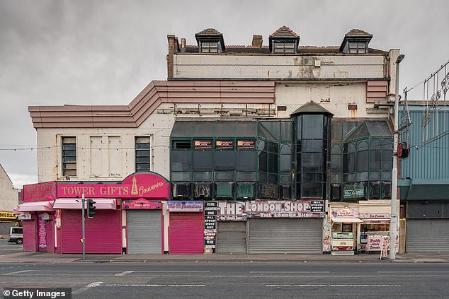 Many shops (one pictured in 2019) have closed in recent years on the high street and promenade
