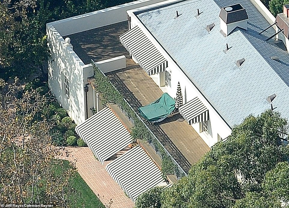 Aerial photos show the music superstar has a double-sized private sunbed in the garden of his sprawling home