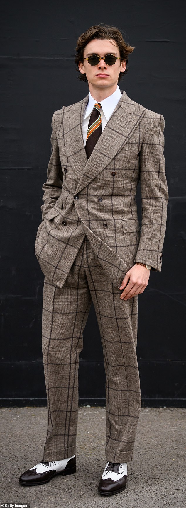 Mathias Le Fevre oozed style as he took part in the popular race, opting for monochrome polished shoes, a smart plaid suit and sunglasses