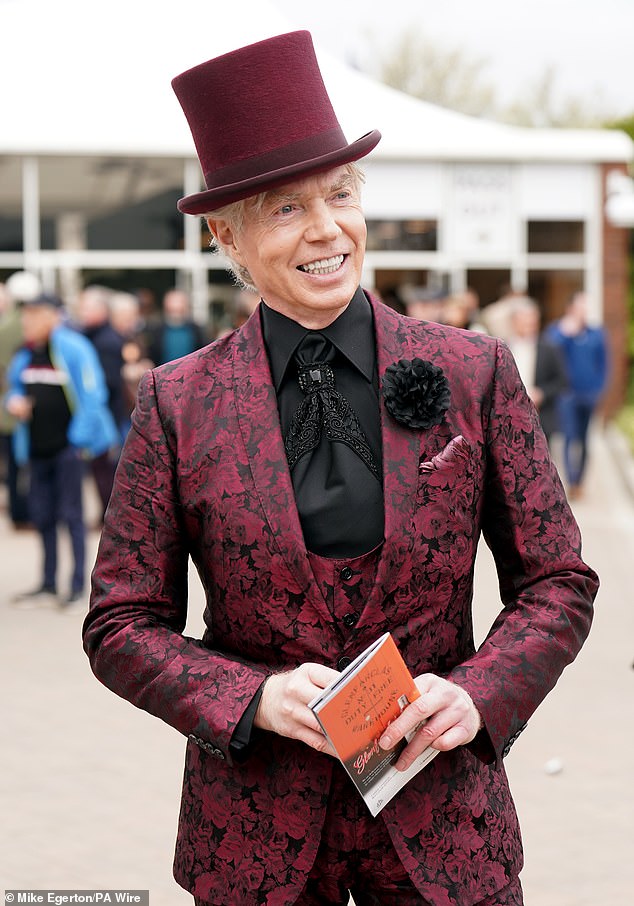 Wonka inspired! Another racegoer opted for a top hat and a purple suit