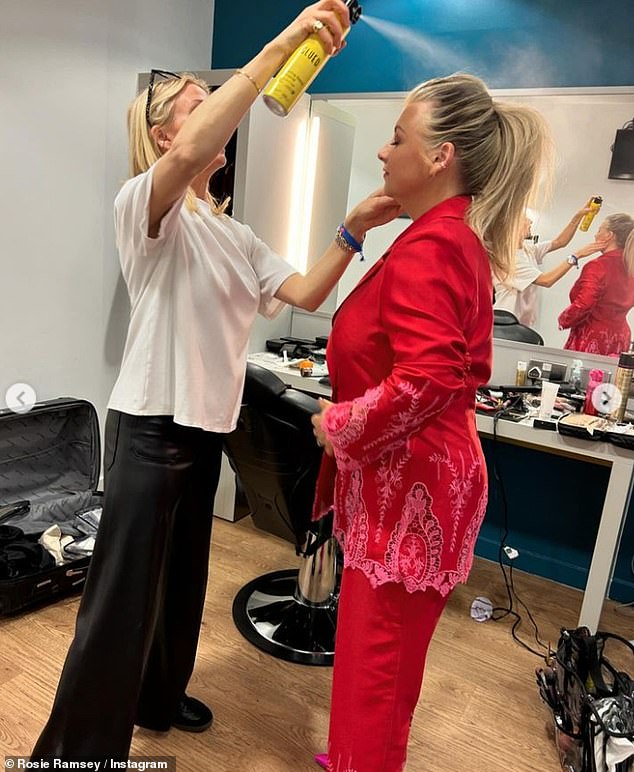 She swept her blonde locks back into a high ponytail as she shared a behind-the-scenes photo of some intense hairspray