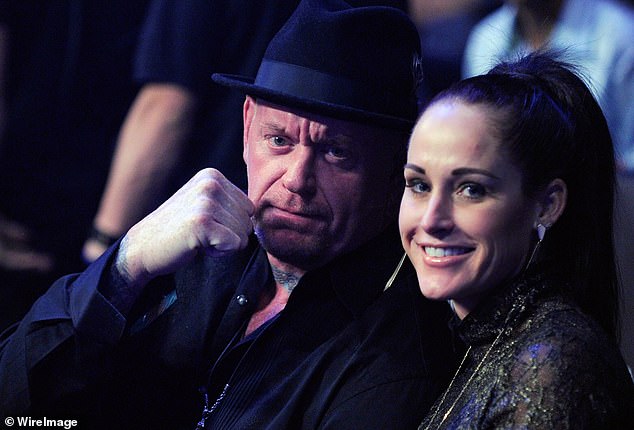 The Undertaker said he spoke with his wife, Michelle McCool (right), about a possible return.