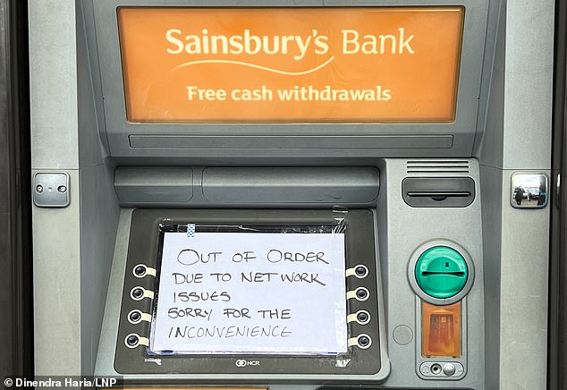 A Sainsbury's Bank ATM in London runs out of cash as the supermarket suffers IT glitches