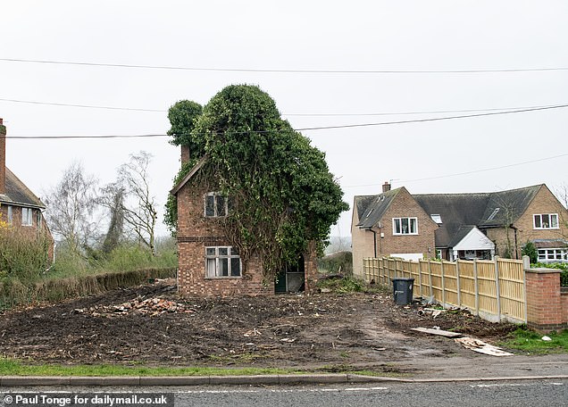Locals were stunned when the house was revealed behind the bushes
