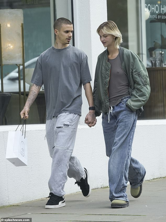 The pair, both 21, walked hand-in-hand during a shopping spree in west London and appeared to be back in each other's company.