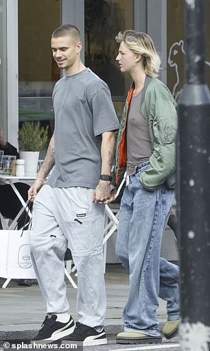 The stylish duo kept it casual as the son of David and Victoria Beckham opted for a pair of Supreme sweatpants and a gray t-shirt