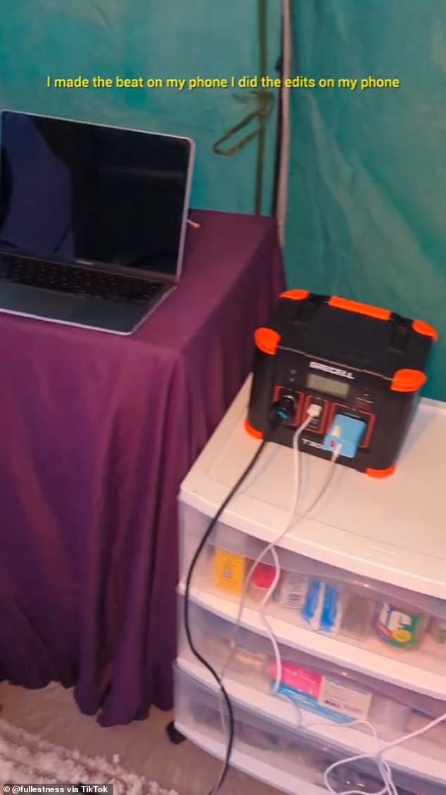 A charging station is used to power the couple's phones and laptops