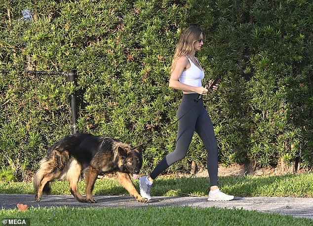 This morning on her walk, she paired her tight sporty gear with a pair of sunglasses to protect her eyes from the bright Florida sun