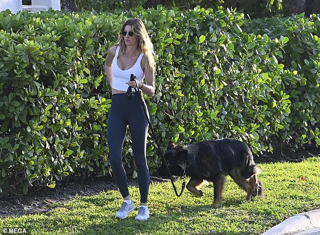The model is often seen walking the German shepherd in her Florida neighborhood