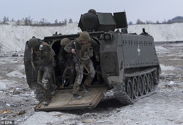 Ukrainian troops conduct exercises with a US M-113 APC in Donetsk, Ukraine, March 15