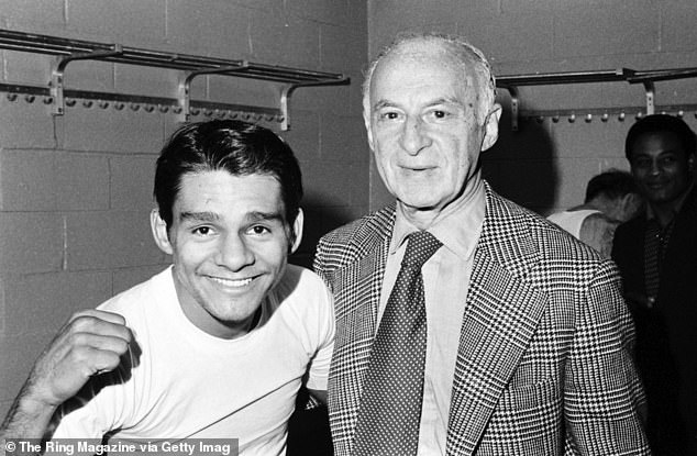 Duran celebrates with trainer Ray Arcel in the locker room after beating Ken Buchanan