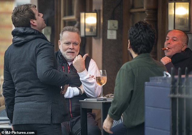 The millionaire was seen chatting and laughing outside The Cavendish pub in Marylebone