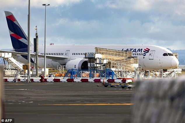 LATAM Airlines Boeing 787 Dreamliner aircraft that suddenly lost altitude mid-flight, crashed violently and injured dozens of travelers, is seen on the tarmac at Auckland International Airport on March 12, 2024