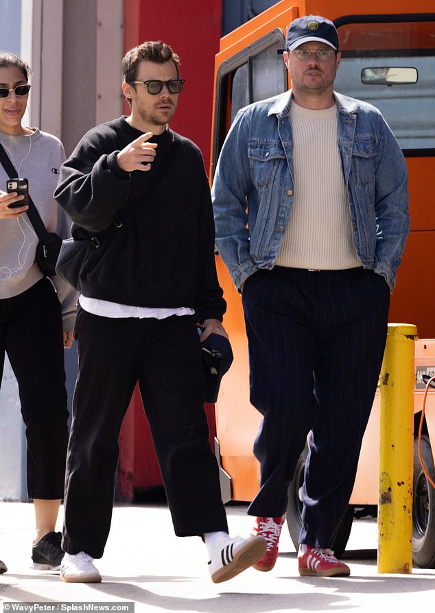 The singer cut a relaxed figure as he made the most of the spring sunshine while out with a pal