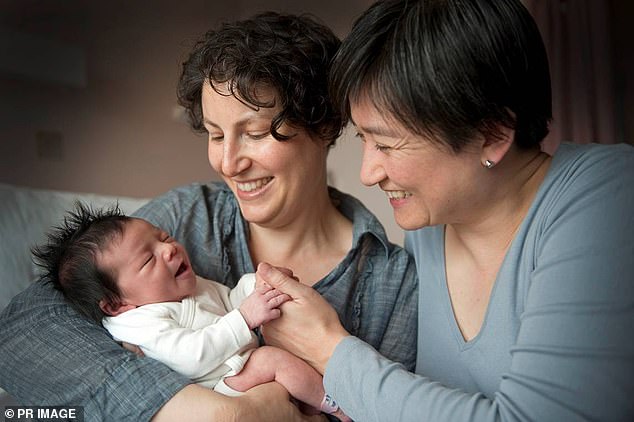 Penny Wong (right) is pictured with partner Sophie Allouache and their daughter Alexandra in Adelaide in 2011