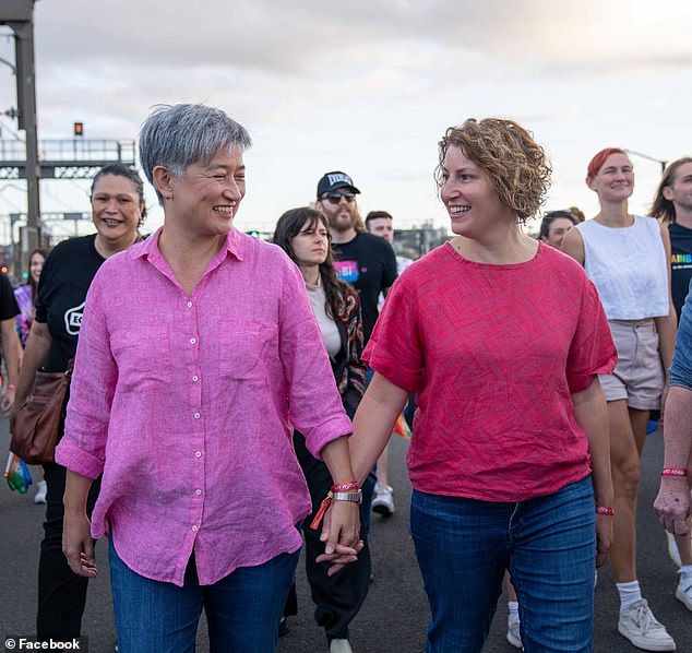 Veteran Labor Senator Penny Wong is pictured with his wife Sophie Allouache