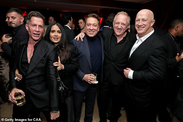 From left, Bruce Bozzi, Salma Hayek, Kevin Huvane, Fracois-Henri Pinault and Bryan Lourd attend CAA's pre-Oscar party at Sunset Tower in Los Angeles, where Maher was a no-show