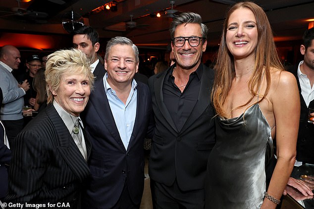 From left, author Diana Nyad, Netflix CEO Ted Sarandos, actor Jon Hamm and his wife Anna Osceola attend the CAA pre-Oscar party at Sunset Tower