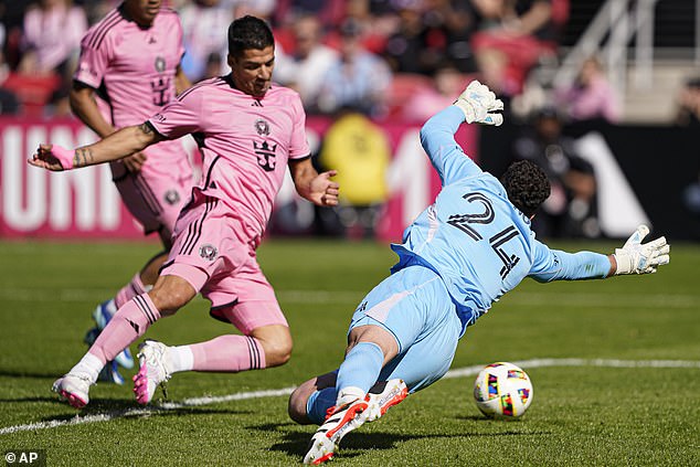 Luis Suárez watches as the ball dribbles under DC United goalkeeper Alex Bono for his first goal.