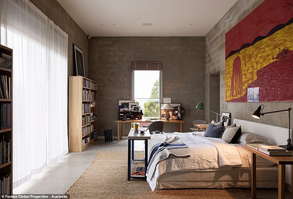 Di Stasio and Powell took an iterative approach to the interior design, with a minimalist theme running through using raw industrial textures. A cozy sitting room adjoins the master bedroom with a home study and a restrained ensuite