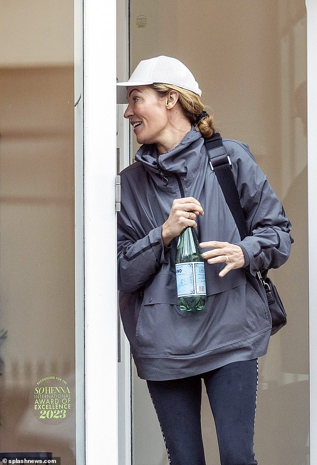 She dressed up for the rainy day, swapping her on-screen glam for a raincoat and leggings