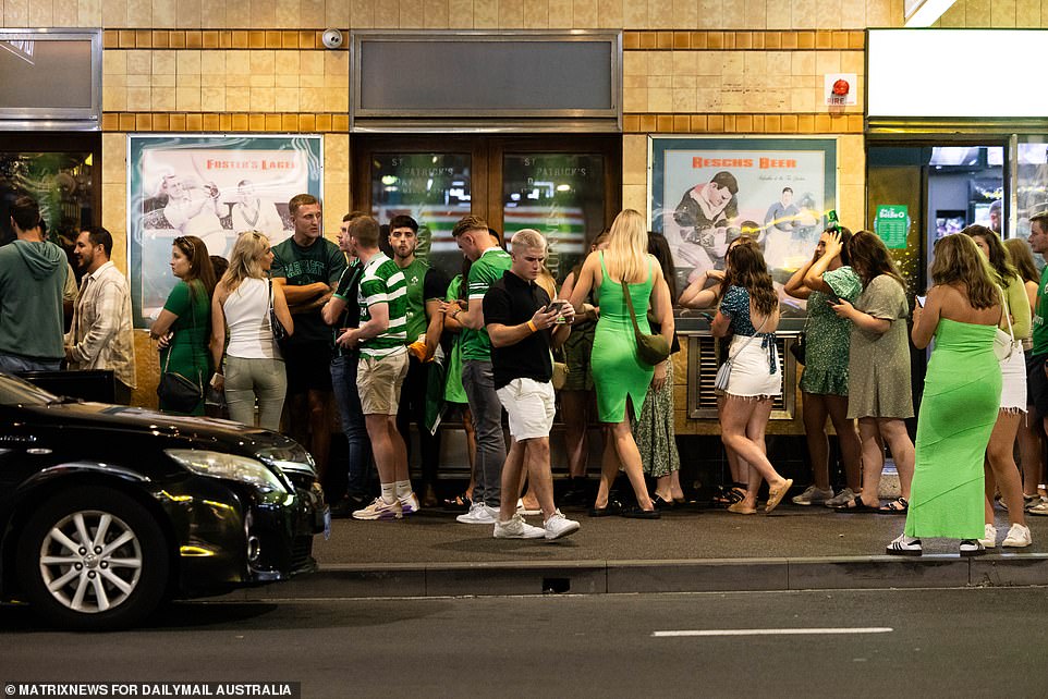Revelers were seen waiting patiently in long queues outside a pub in Sydney