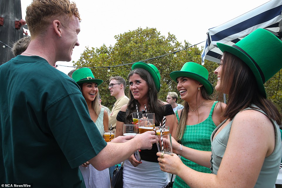 Some donned oversized green hats as they enjoyed a beer at the Glenmore Hotel in the Rocks in Sydney