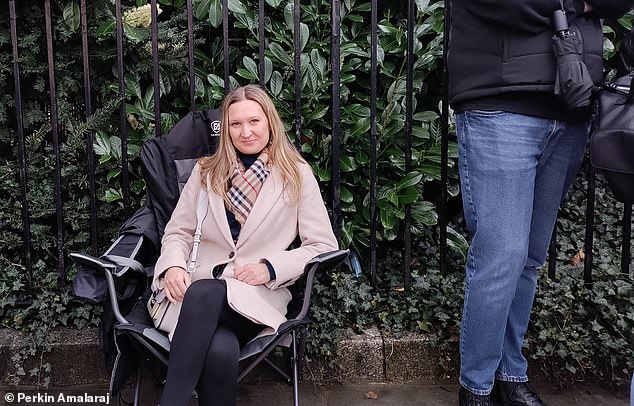 Ekaterina, a 42-year-old office worker, (pictured) said she and her friend had been waiting at the embassy for almost three and a half hours