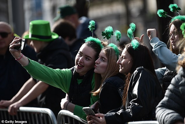 A group of women take a selfie under St.  Patrick's Day Parade on March 17, 2024 in Dublin, Ireland