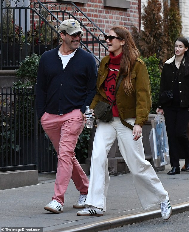 The Mad Men actor, 53, looked preppy in pink trousers with a white t-shirt and navy cardigan