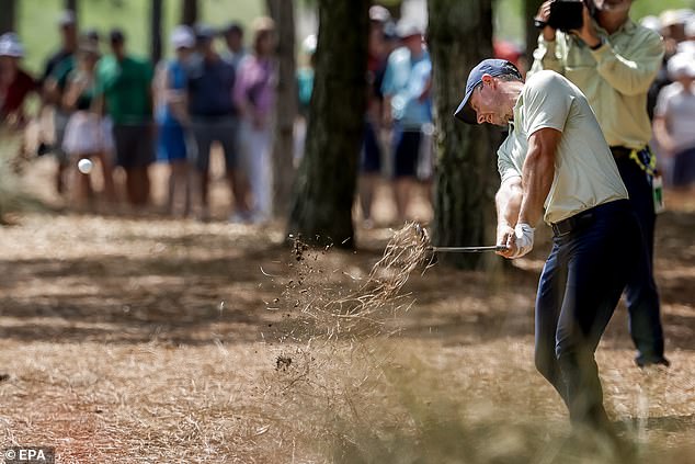 McIlroy hits from the pine straw in the first of the final round of The Players Championship