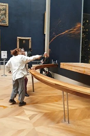 This is the moment the activists throw soup at the Mona Lisa