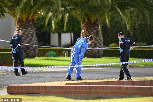 The police manhunt for John Latorre's killer entered its seventh day on Monday.  Pictured are forensic scientists at the crime scene
