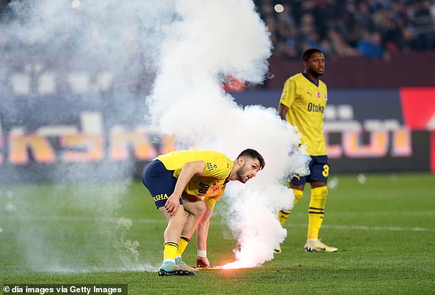 The winner provoked an immediate reaction from hostile fans with flares and other objects thrown onto the field.