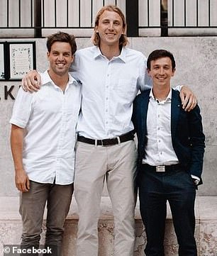 Mr East is pictured (right) with friends