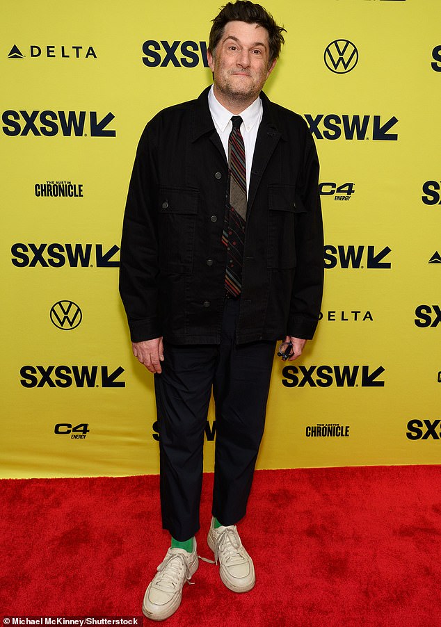 Meanwhile, Michael Showalter, the film's director, wore a shirt and tie under a more casual jacket, pairing the look with sneakers.