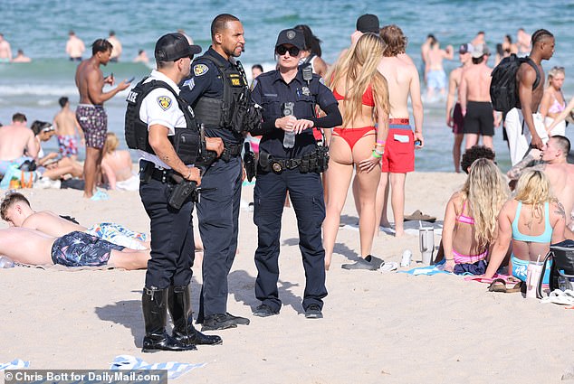 Police patrol a beach in Fort Lauderdale during spring break, Tuesday, March 12, 2024.