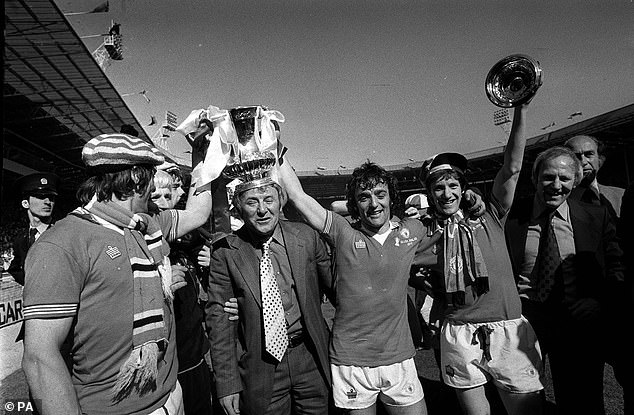 (left to right) Stuart Pearson, Tommy Cavanagh, Tommy Docherty, Lou Macari, Gordon Hill and Frank Blunstone celebrate after Manchester United's FA Cup final victory over Liverpool at Wembley
