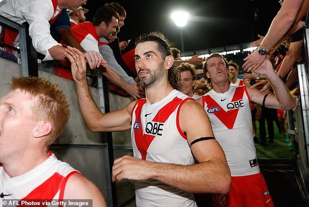 Brodie Grundy (pictured center after Friday night's win over Collingwood) has proven to be a revelation for the Swans since leaving the Demons.