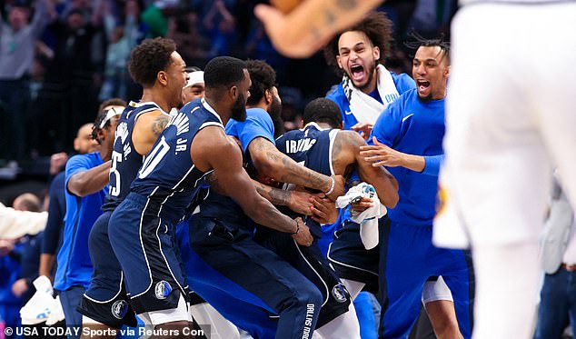 Irving (11) celebrates with his teammates after the victory against the Denver Nuggets in Dallas