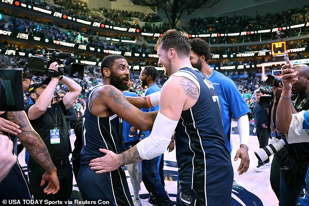 Luka Doncic (right) and Kyrie Irving (left) celebrate after the latter's game-winning shot