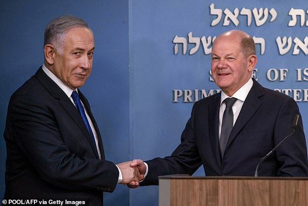 Israeli Prime Minister Benjamin Netanyahu (left) and German Chancellor Olaf Scholz (right) shake hands after a joint press conference following their meeting in Jerusalem on March 17.