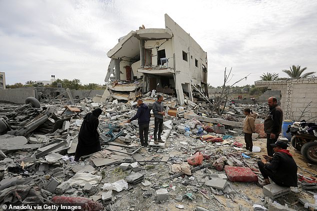 A view of the area after the Israeli attack on a building in Deir al-Balah, Gaza, on March 16