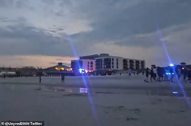 The blue lights of police cars were visible from Jacksonville Beach.