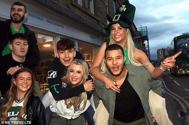 LEEDS: A group of students dressed in green pose for a photo as they enjoy the festivities