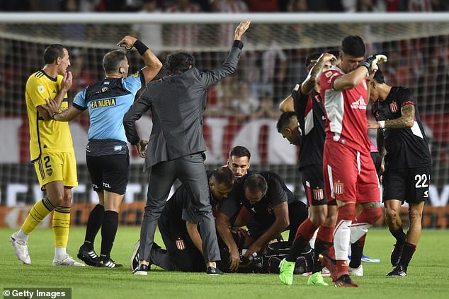The players were visibly upset when the referee and officials called for medical help.